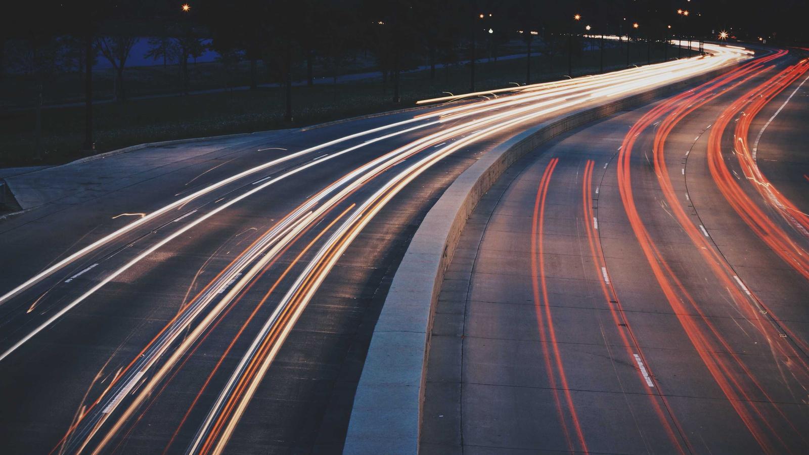 The input photo: light trails on a night highway